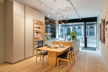 modern kitchen and dining area with minimalist design and ample natural light