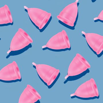 eco friendly and reusable pink menstrual cup pattern on blue background