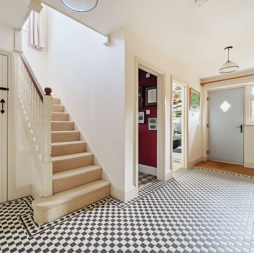 hallway with black and white tiles