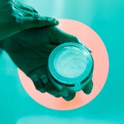 person applying cream to hands person applying cream to hands