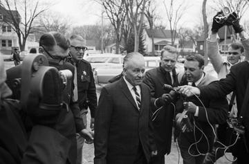 ed gein with police and reporters