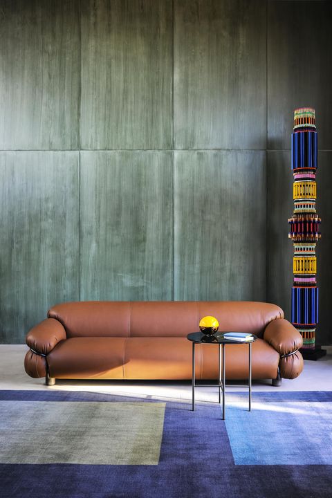 Couch, Furniture, Wall, Floor, Architecture, Flooring, Interior design, Art, Wallpaper, 