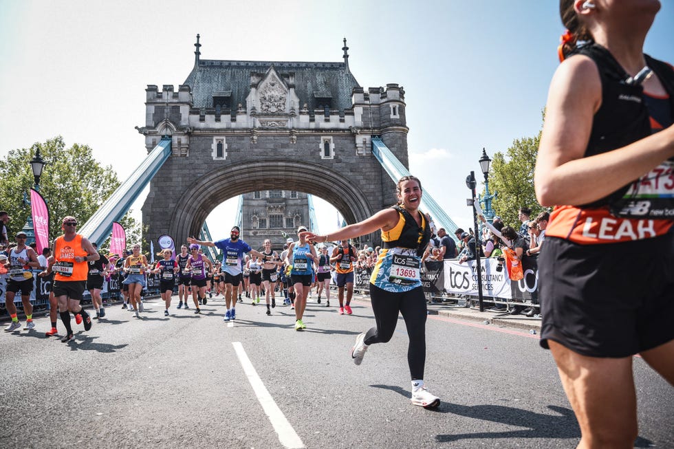 participants running in a marathon near the iconic tower bridge