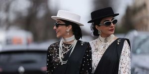 a couple of women wearing hats and sunglasses