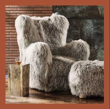 a fuzzy gray lounge chair and an orange lounge chair