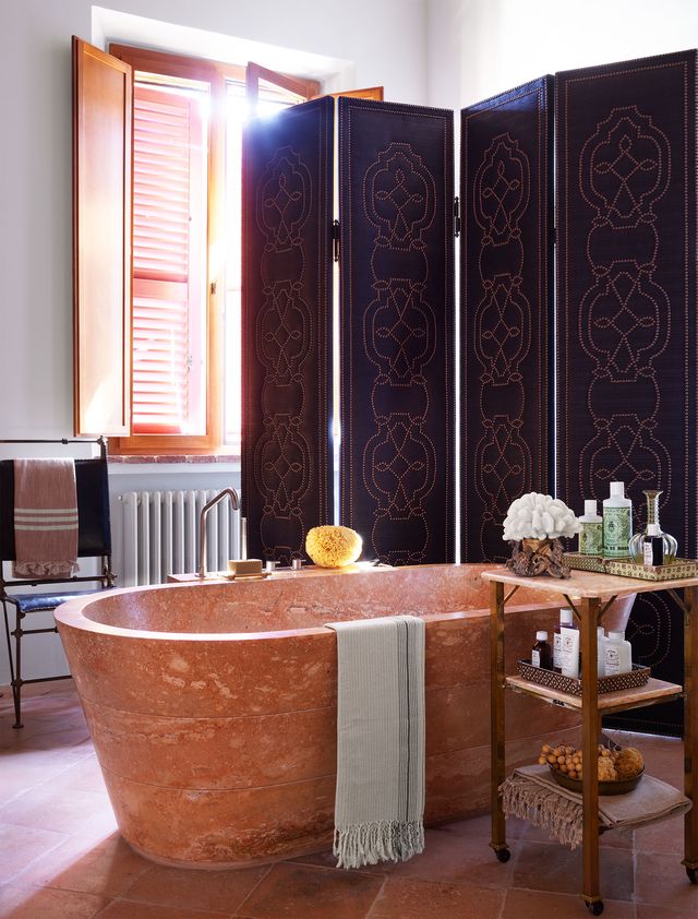 bathroom with large wooden tub