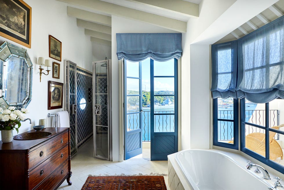 a bathroom with a tub and a sink