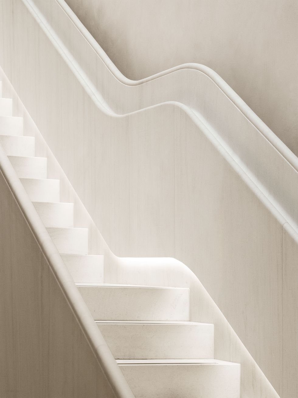 white staircase with rounded treads and undulating shape