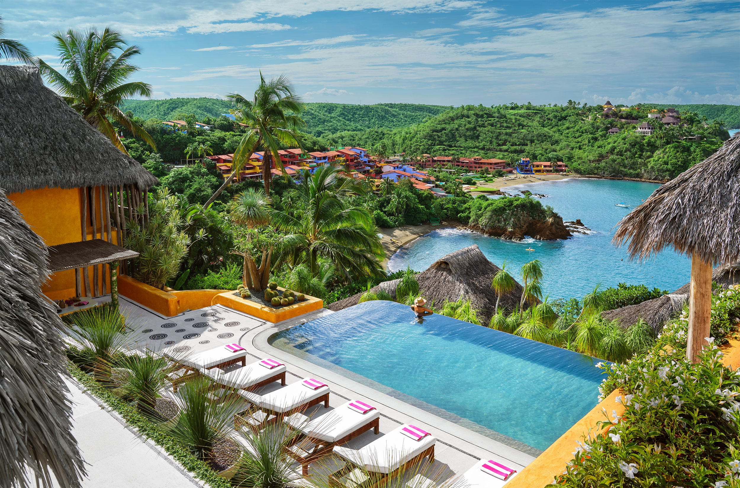 With Sherbet Hues and Thatched Roofs, This Exclusive Mexican Oasis Is a Tropical Shangri-La