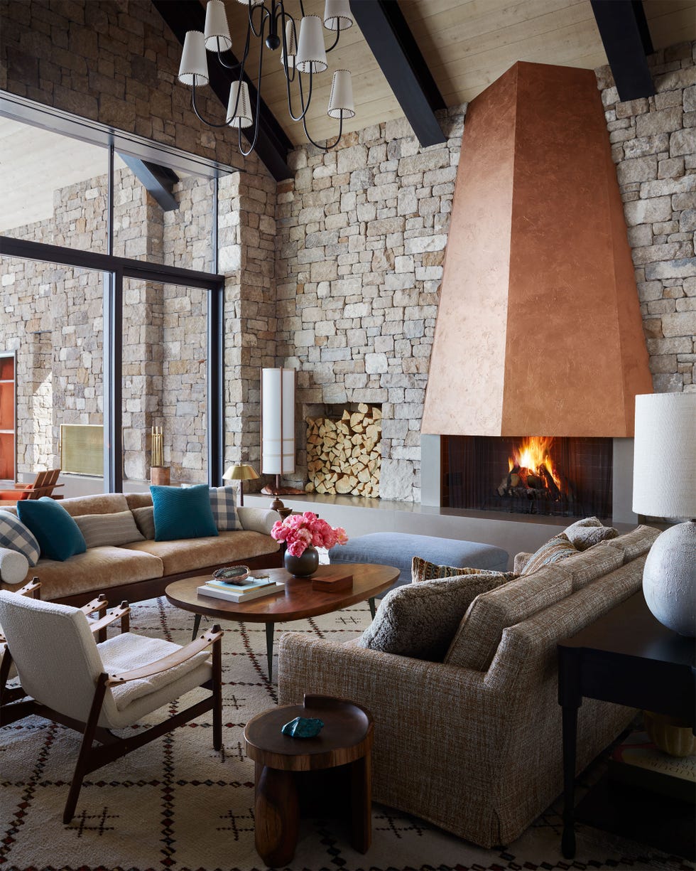 Commune - ELLE DECOR living room with roaring fireplace in a home designed by commune