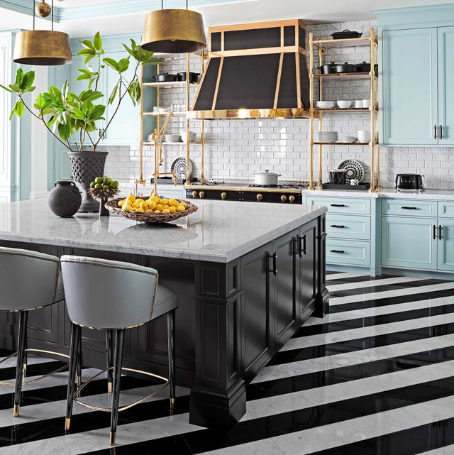 kitchen with aqua cabinets and a black island with black and white striped floors