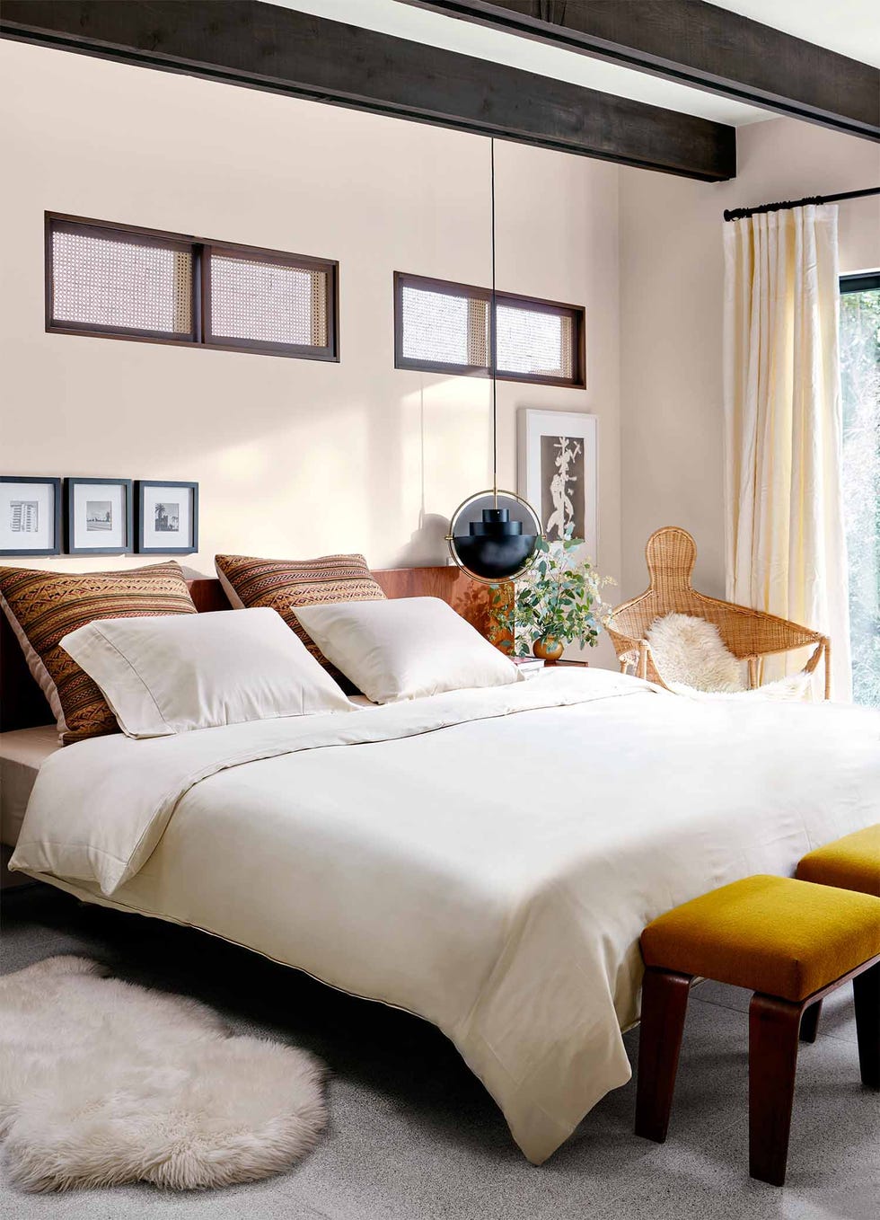 sophia bush hollywood house sophia bush guest bedroom with white bedding cutout windows and a pendant above the bedside table