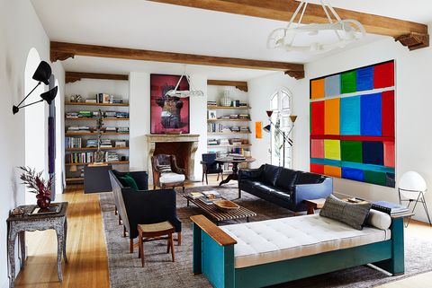 living area with leather settees and large colorblocked artwork