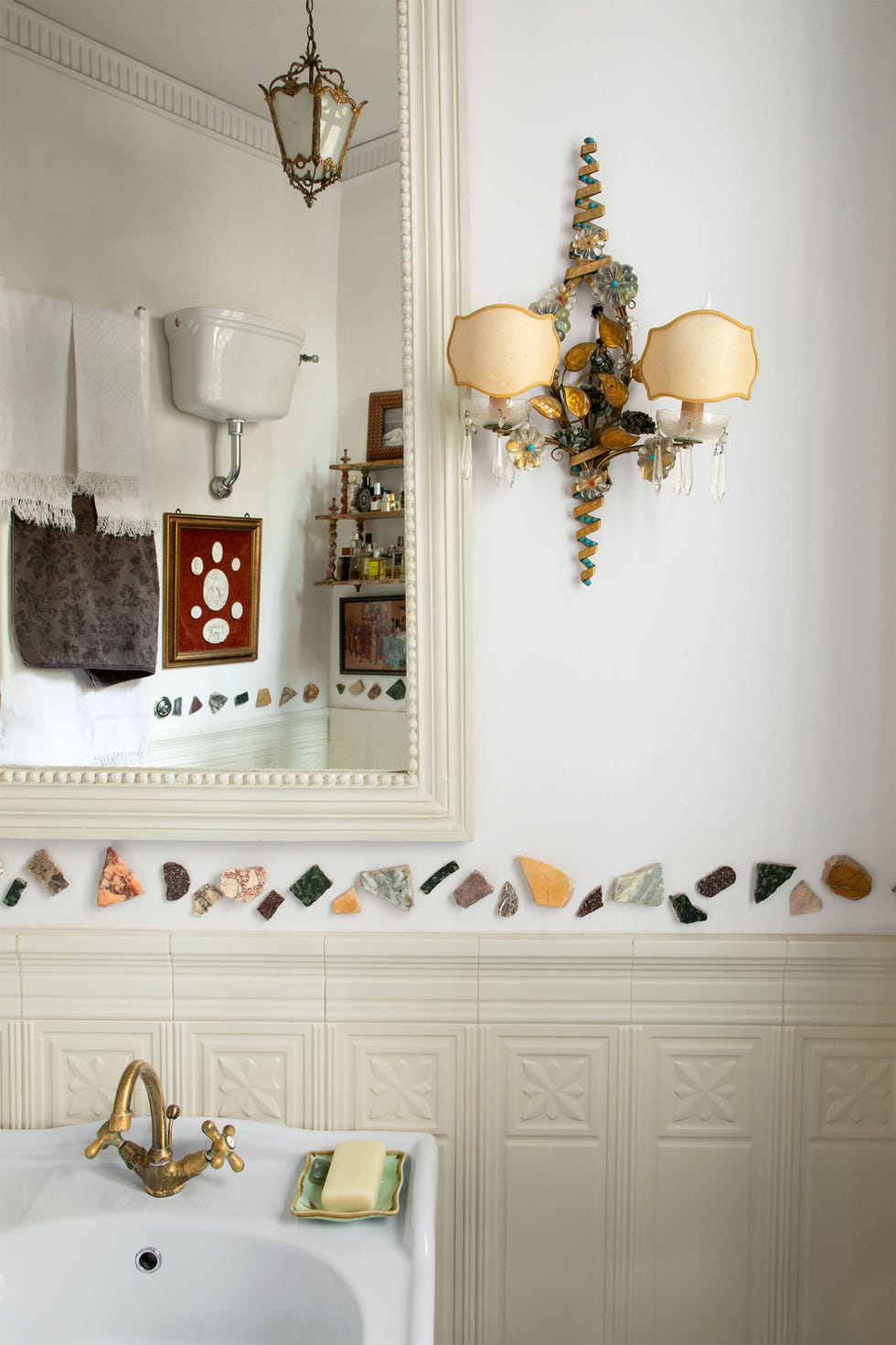 a bathroom with a mirror and a sink