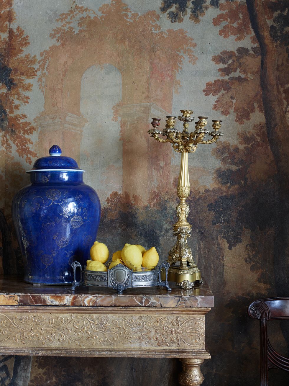detail of gilt table with large blue vase
