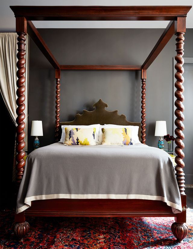 four poster bed with gnarled wooden posts