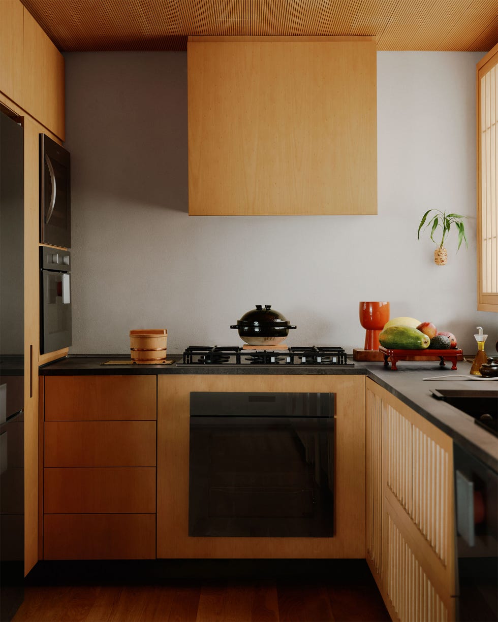 kitchen with wood cabinetry and black countertop and appliances, putty colored wall, covered rice pot on stove, vegetables on a tray on counter, wood plank floor, ribbed wood ceiling