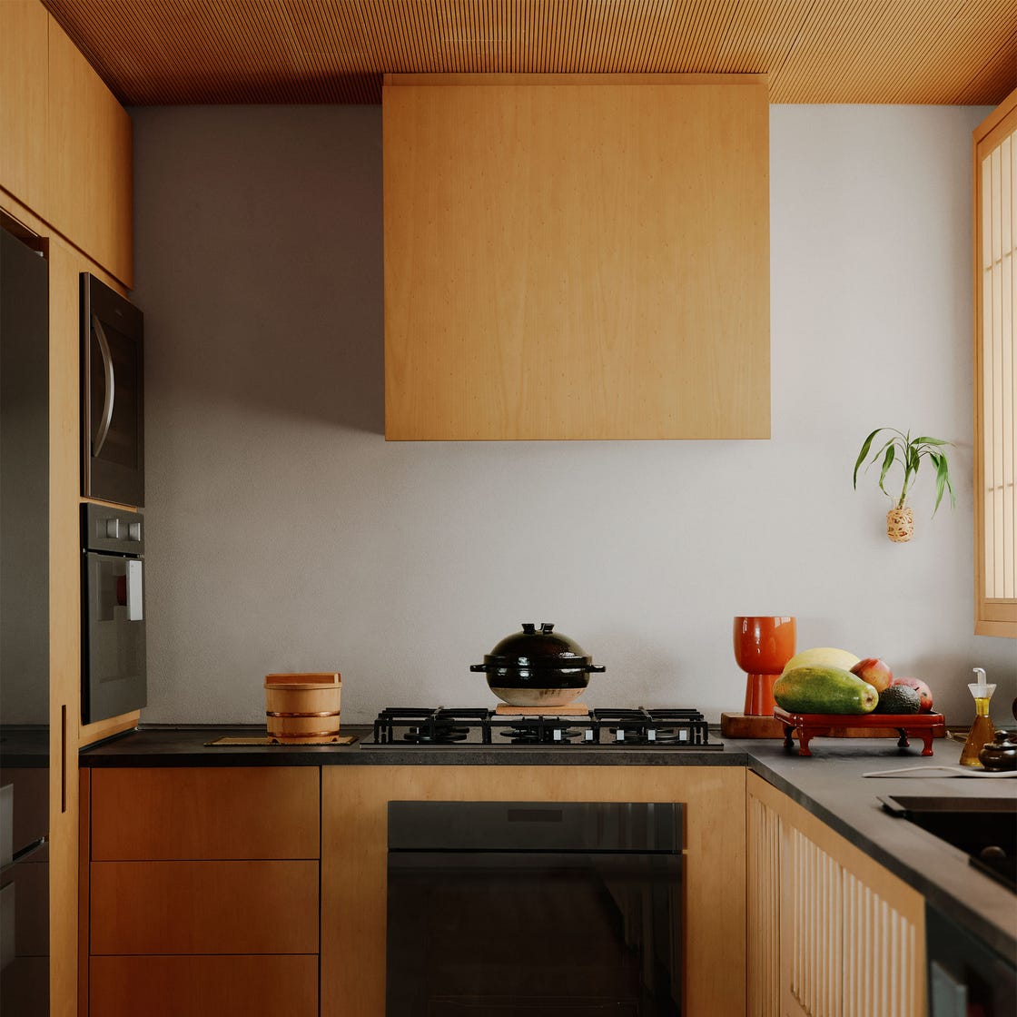 Silvia Furmanovich - ELLE DECOR kitchen with wood cabinetry and black countertop and appliances, putty colored wall, covered rice pot on stove, vegetables on a tray on counter, wood plank floor, ribbed wood ceiling