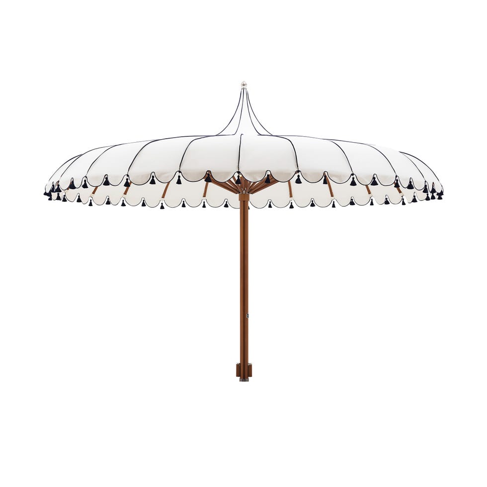 large outdoor umbrella with a scalloped edge and wooden pole