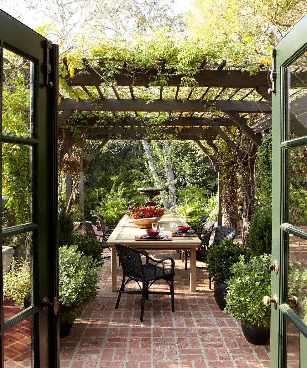 a patio with a table and chairs