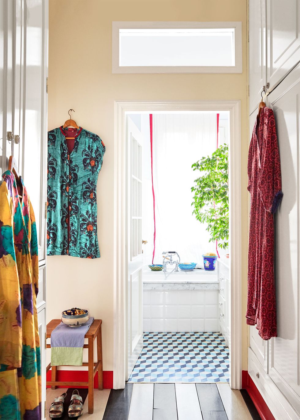 dressing room off bath with colorful caftans hanging