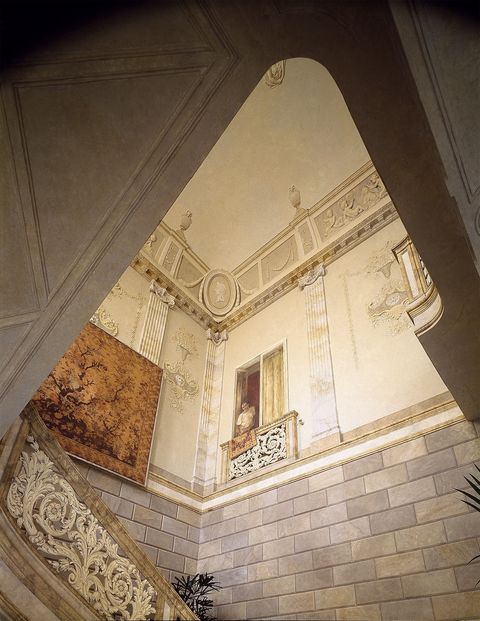 large vaulted stair hall with painted stone blocks