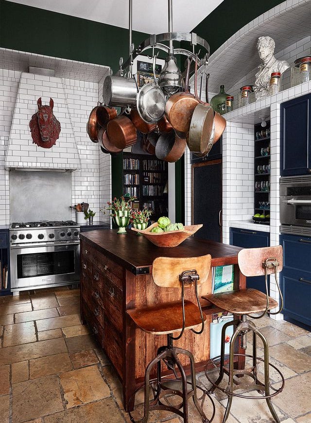 a kitchen with a table and chairs a kitchen with a table and chairs