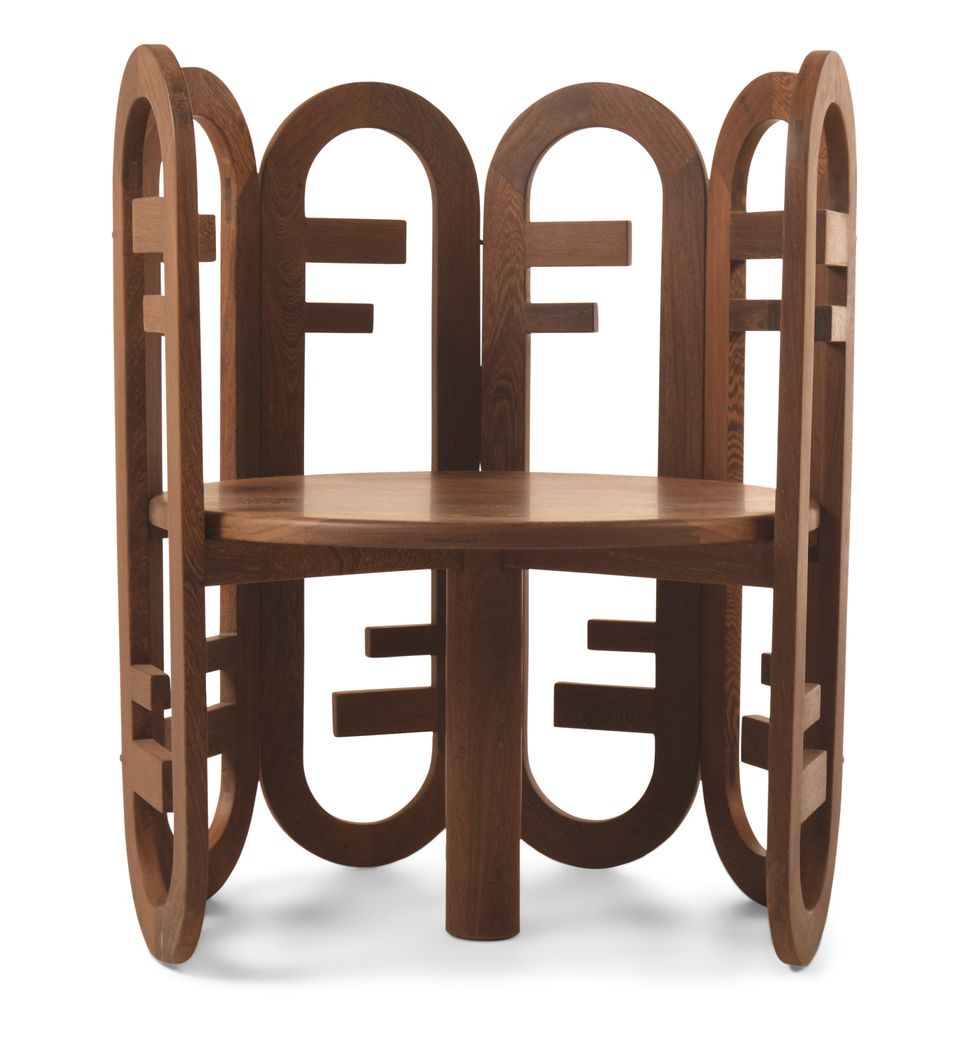 wooden chair with a straight pedestal base and round seat and long oval sides arranged in a semicircle