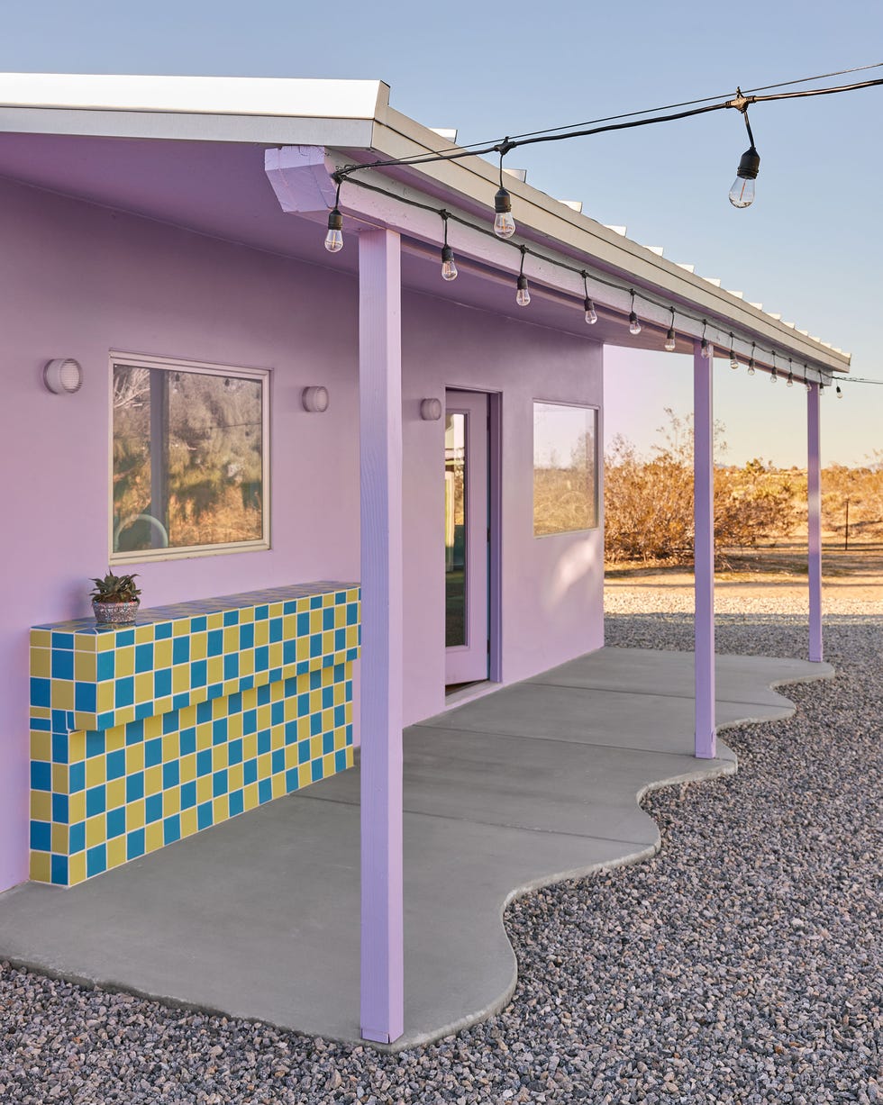an outdoor bar underneath the awning of a colorful home an outdoor bar underneath the awning of a colorful home