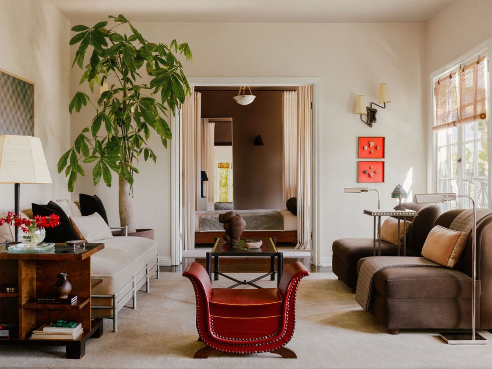 a living room with a couch and chairs