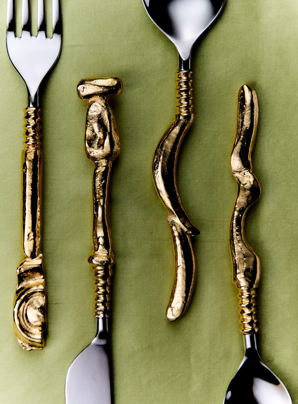 gold plated set of fork, knife, spoons