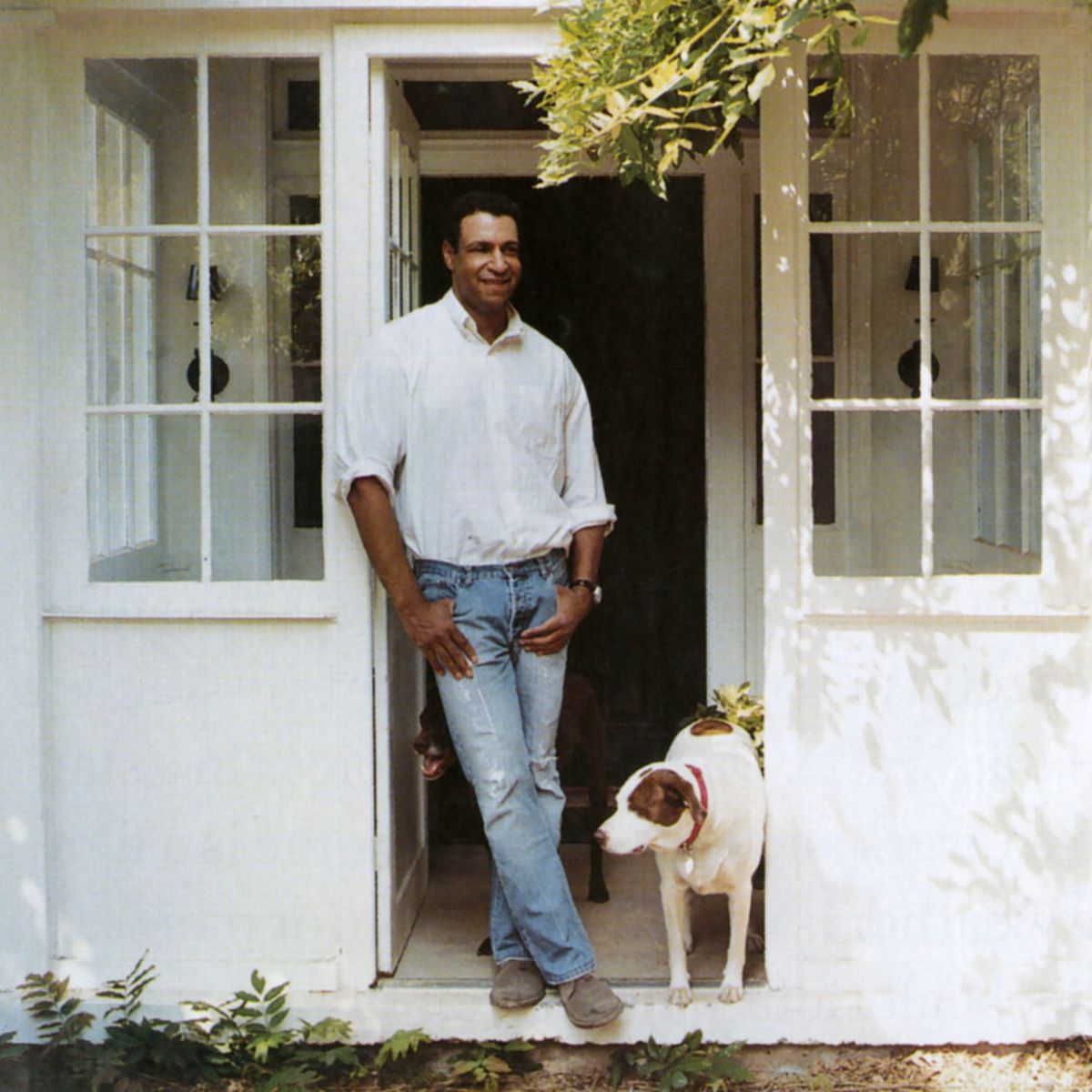 interior designer darryl carter at his 19th century farmhouse in virginia with his dogs otis and lucy