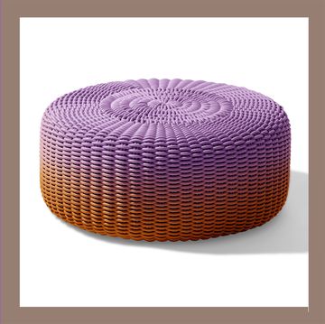 chair on the left and a purple moire pouf on the right