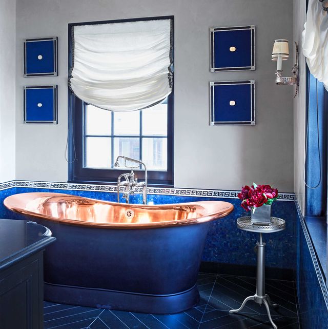 bathroom with blue and copper tub designed by branca