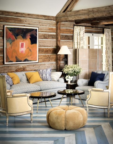 jeffrey bilhuber family room with matching sofa and armchair and painted geometric floor