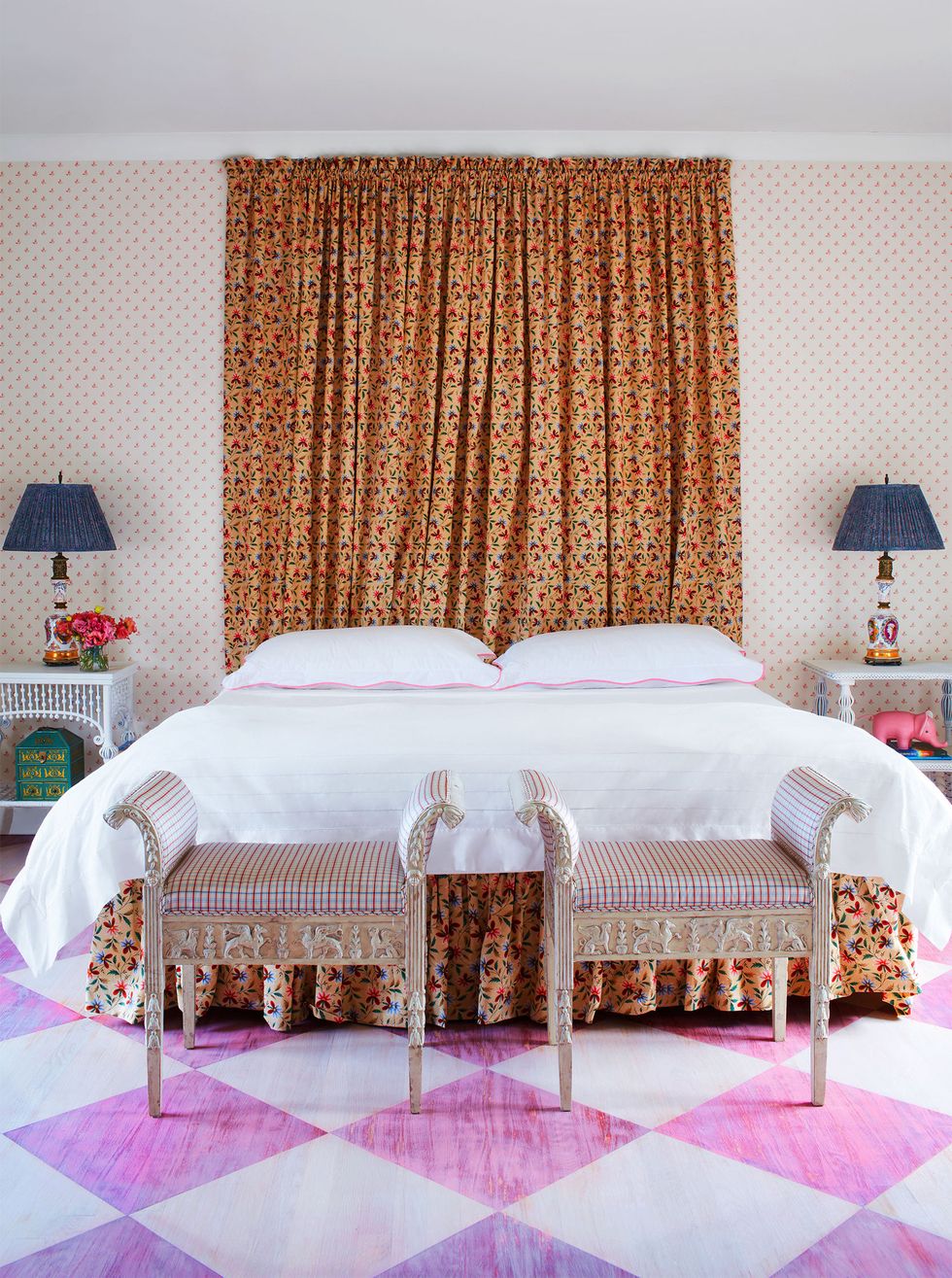 bed with matching patterned curtains and benches