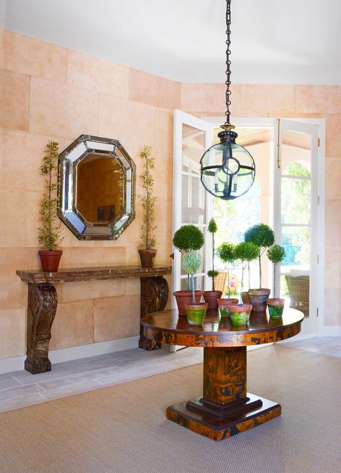 entryway with table and mirror