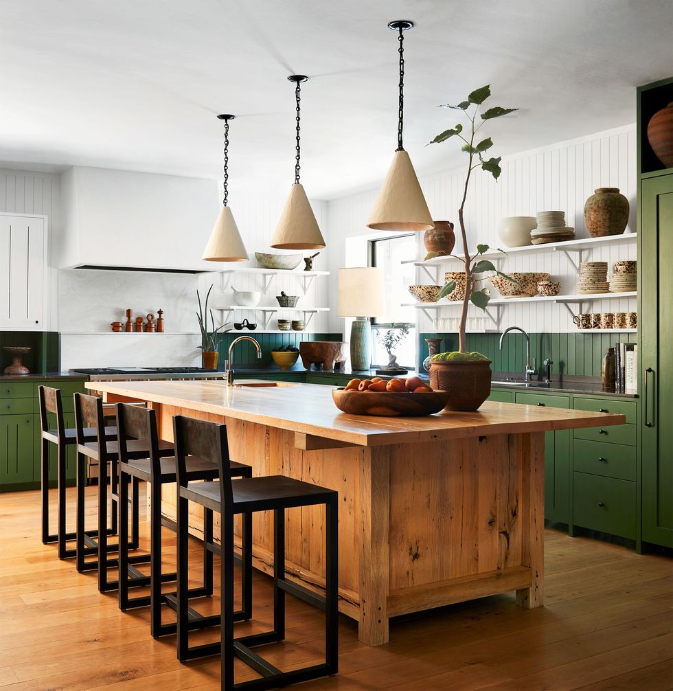 green kitchen with wooden center island