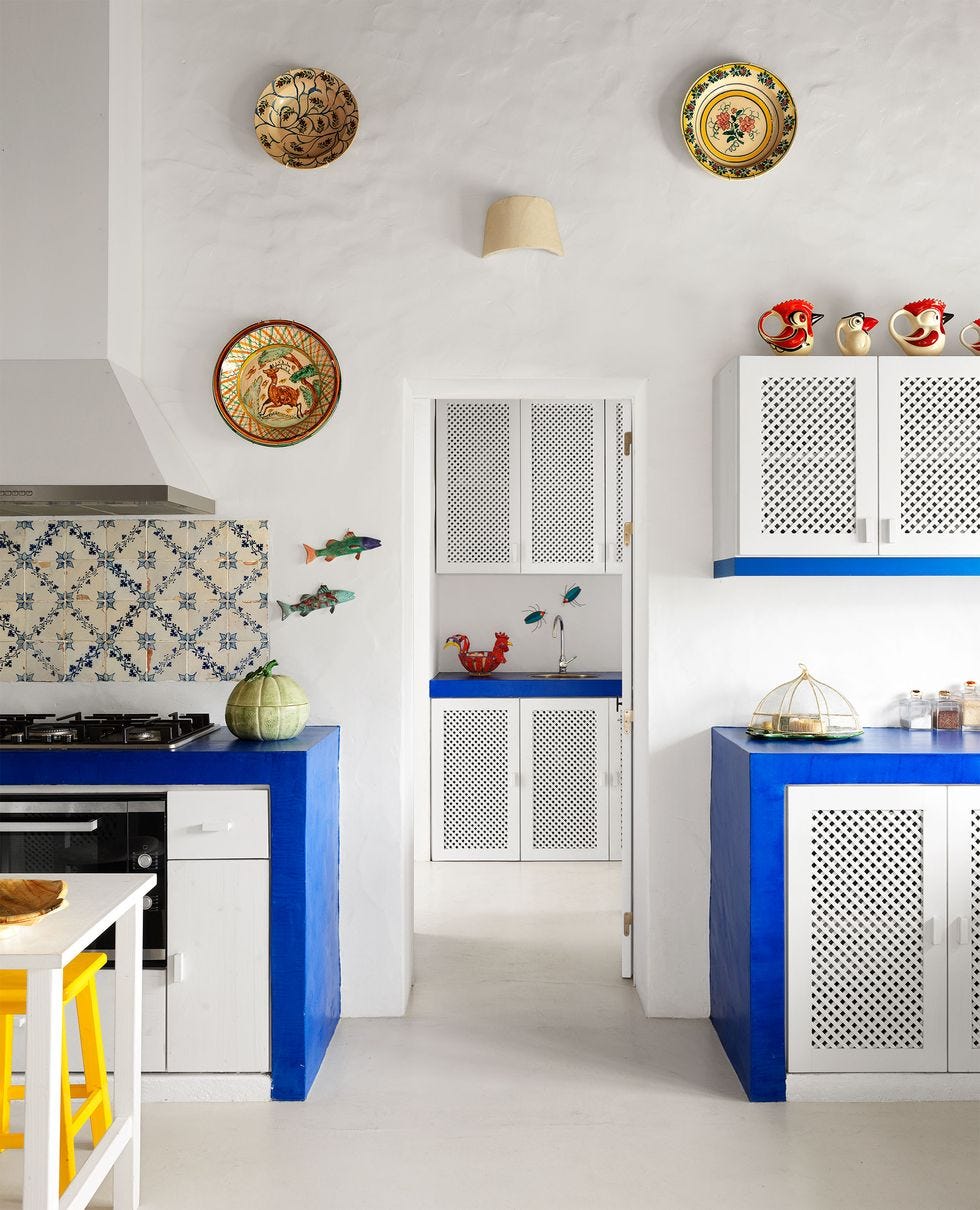 a kitchen with white cabinets a kitchen with white cabinets
