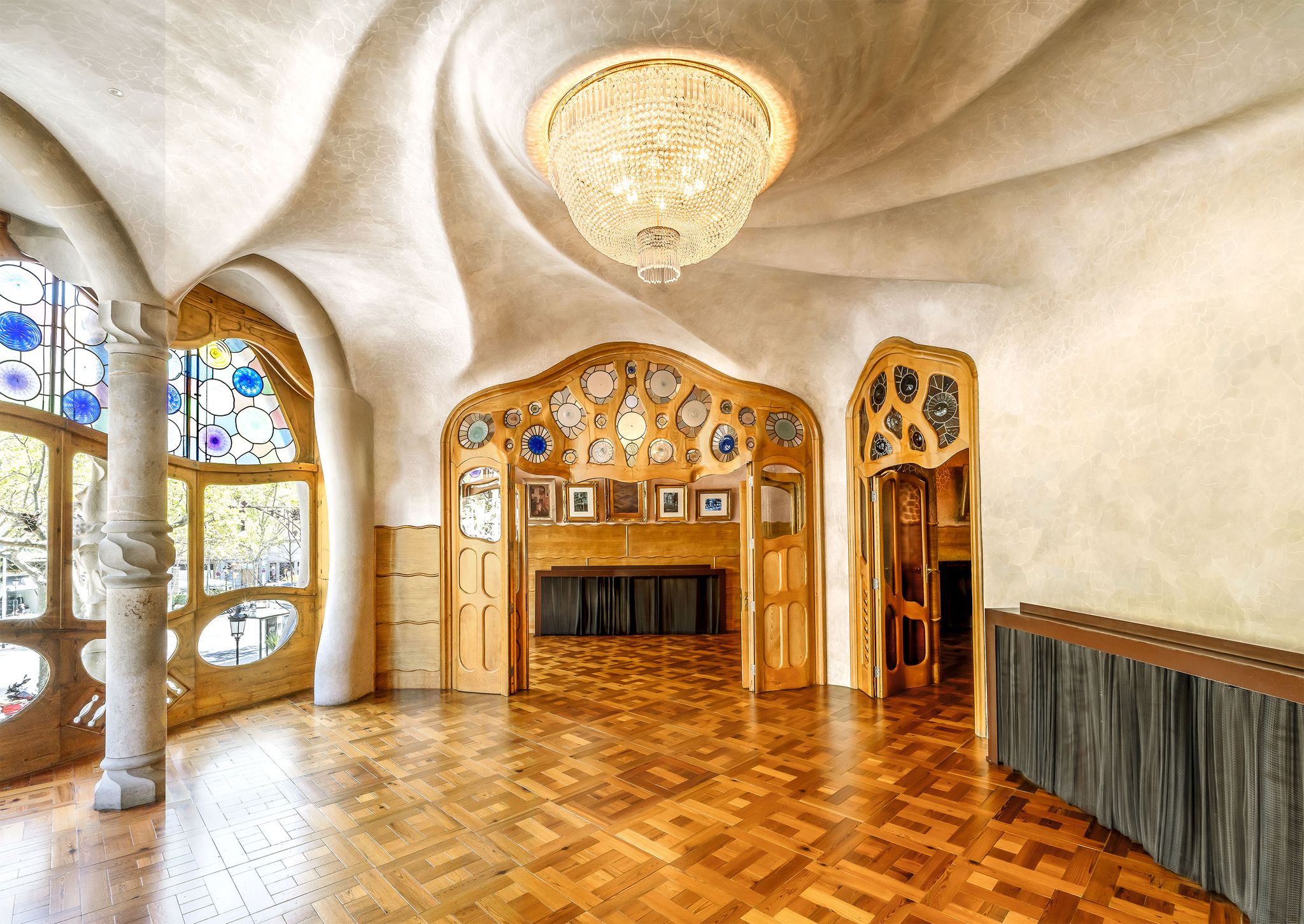 interior of casa batlló in barcelona a gaudi house with undulating frames on the doors and stained glass windows