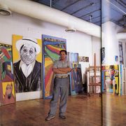the artist frederick brown standing in his studio amidst his tall paintings