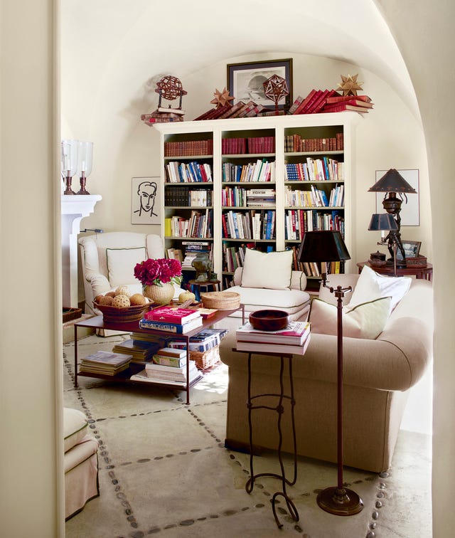 pale living room with bookshelf and matisse sketches