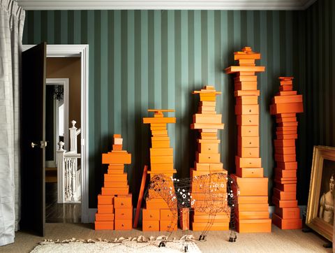 sitting room with colorful orange hermes boxes