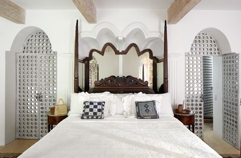 white airy bedroom with moroccan panels