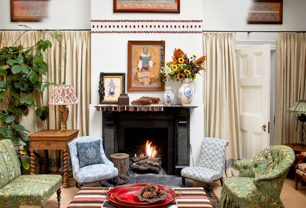 studio fireplace with two slipper chairs on either side