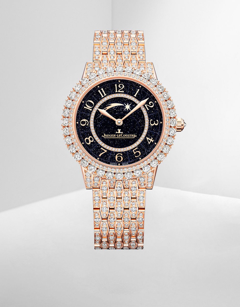 diamond and gold wrist watch with a black face