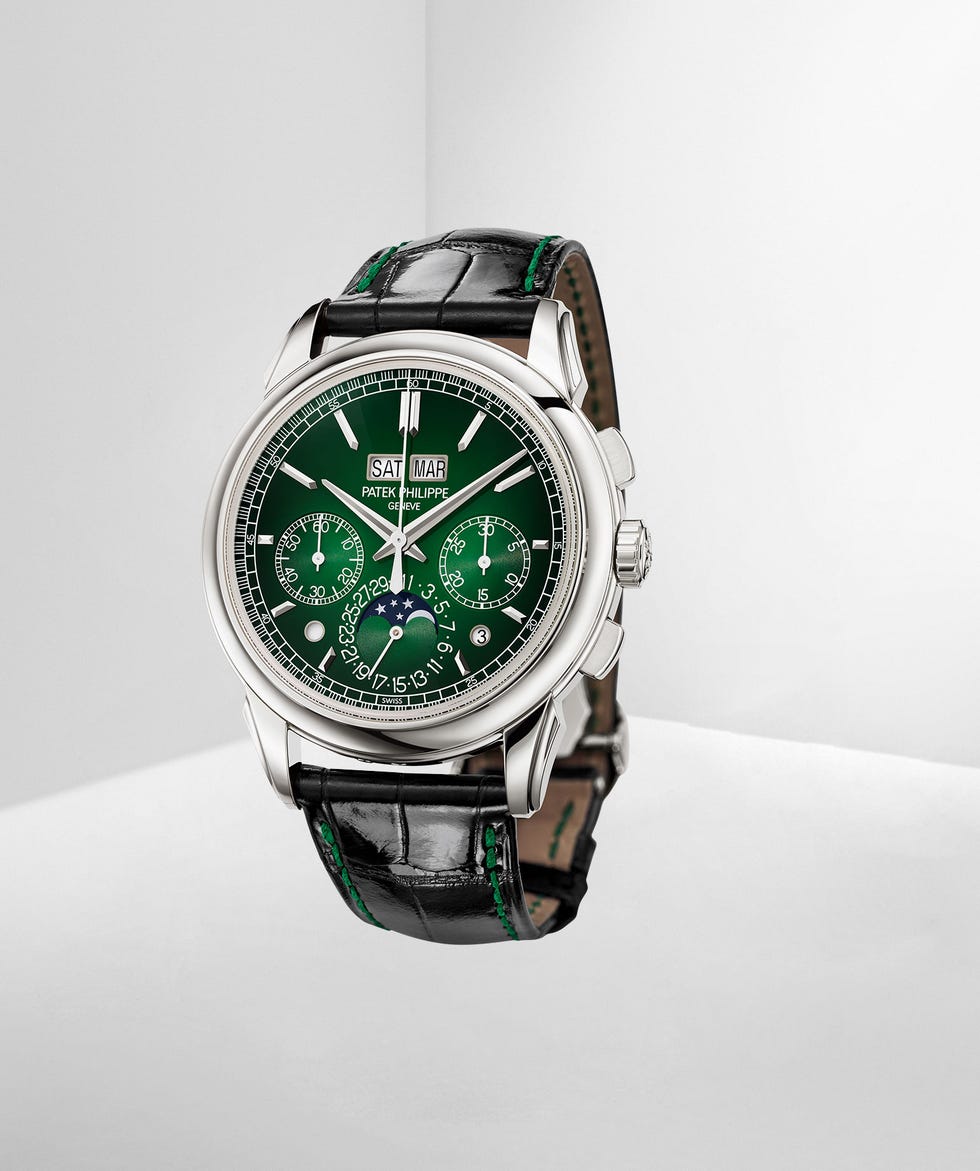 silver watch with dark brown leather band and green moire face