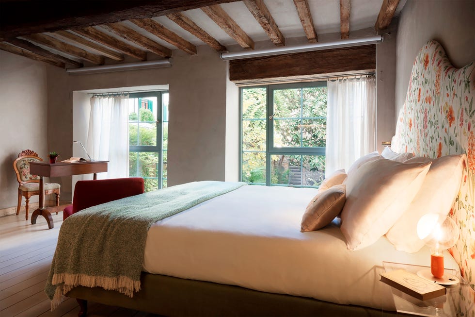 bedroom with rafter ceiling and nice view