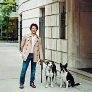 decorator nate berkus outside his chicago apartment with his border collie mixes henry left and emma