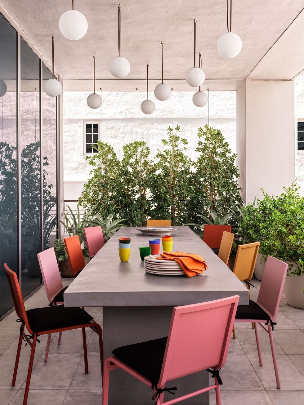 a table with chairs and a plate of food on it